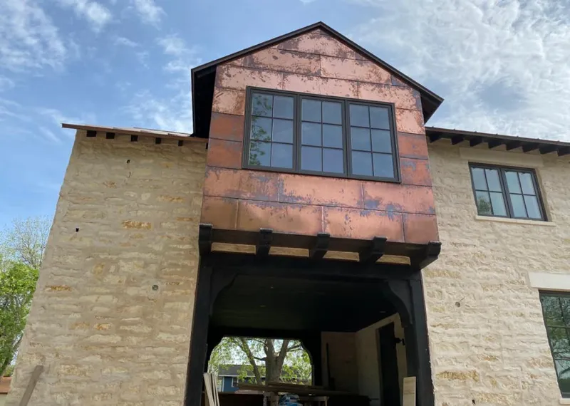 Copper metal panel facade on a stone building for Metal Roof Coating in Seal Beach