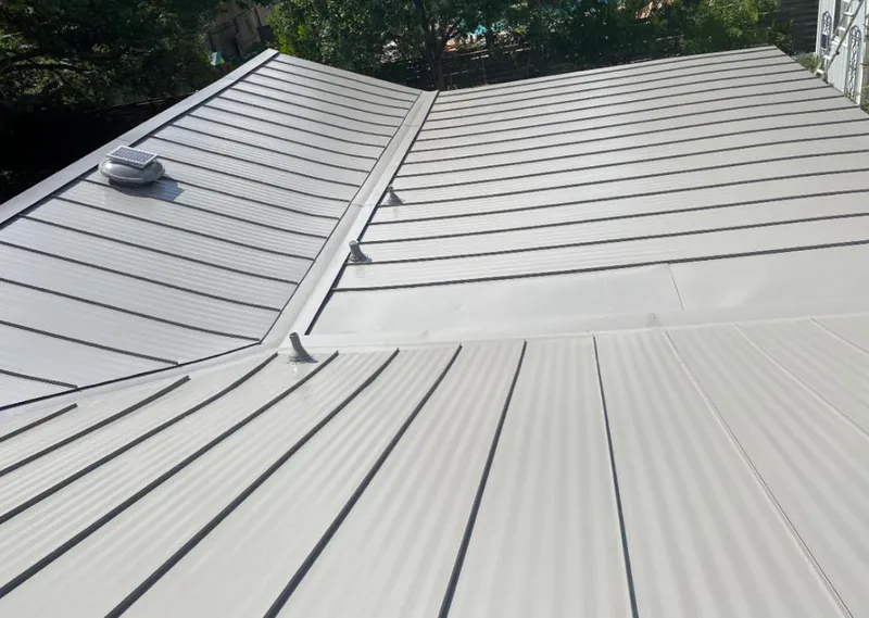 Solar attic fan installed on a metal roof for Roof Ventilation in Seal Beach